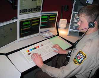 Deputy Nick Altom at a modern dispatch station